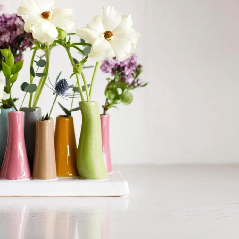 Pooley Magenta 8 Tube Ceramic Flower Vase - Close up of styled decorative vases with an arrangement of flowers for a table or desk setting