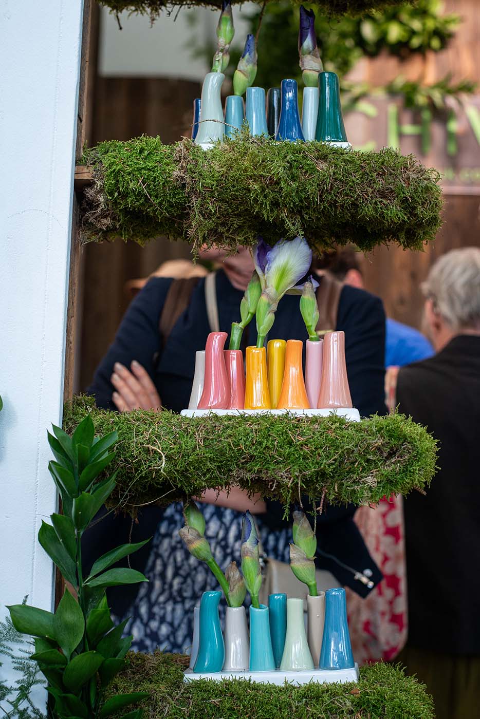 Chive Studio at Chelsea Flower Show displaying ceramic pooley vases of different colors.