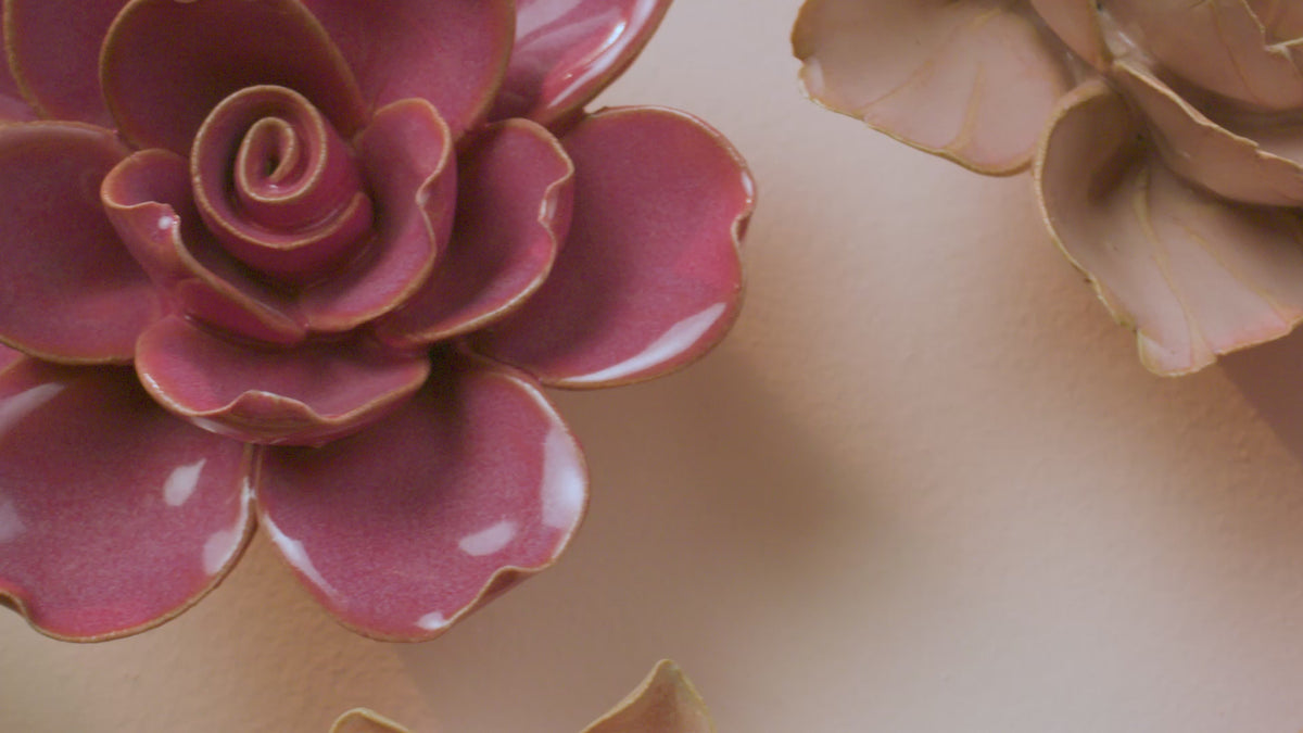 A slow left-to-right pan across France Collection ceramic flowers — french country decor in blush, peach, and soft teal.